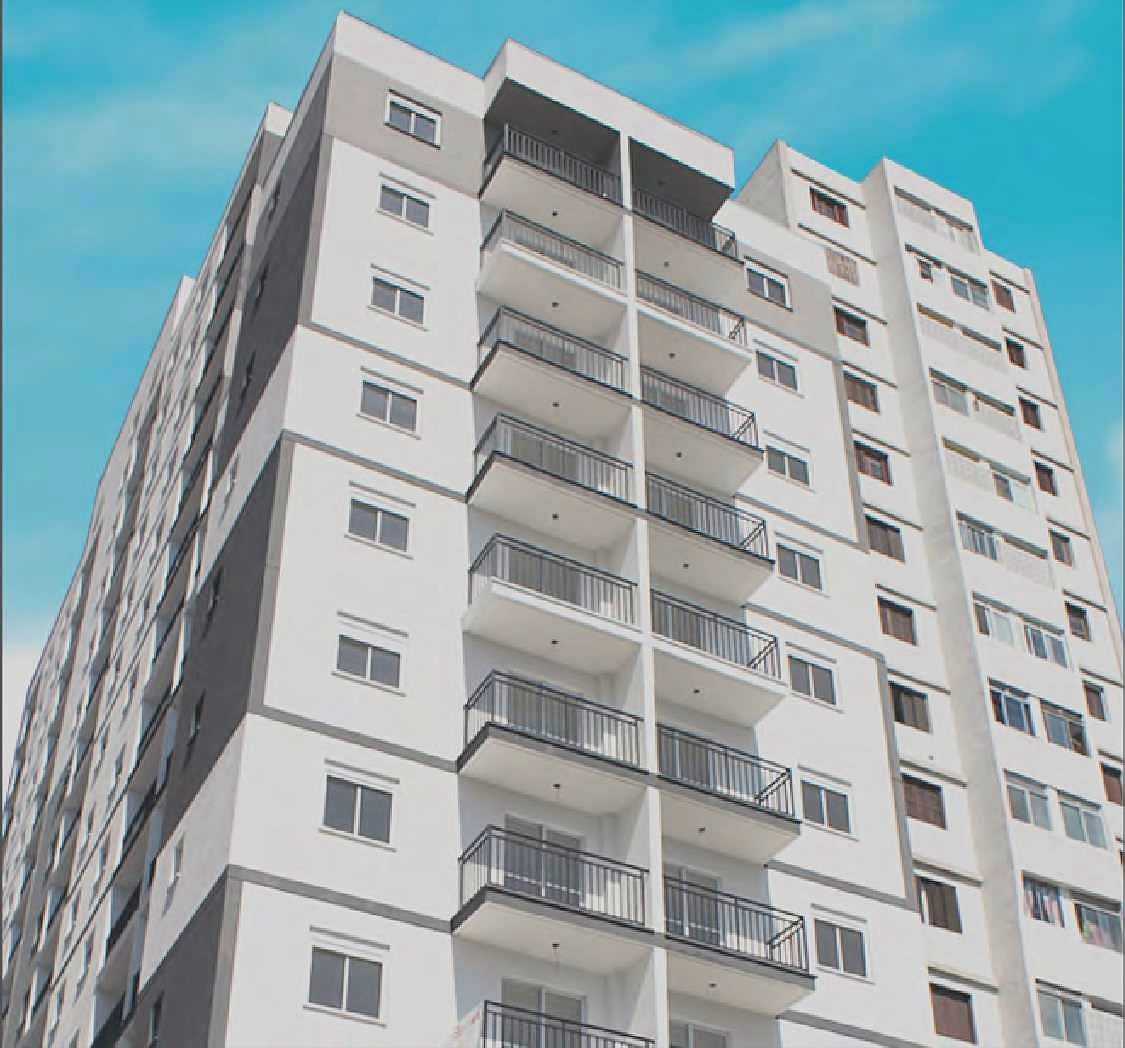 Foto da fachada do Br Caetano entregue, vista de baixo, com as varandas da torre contra o céu