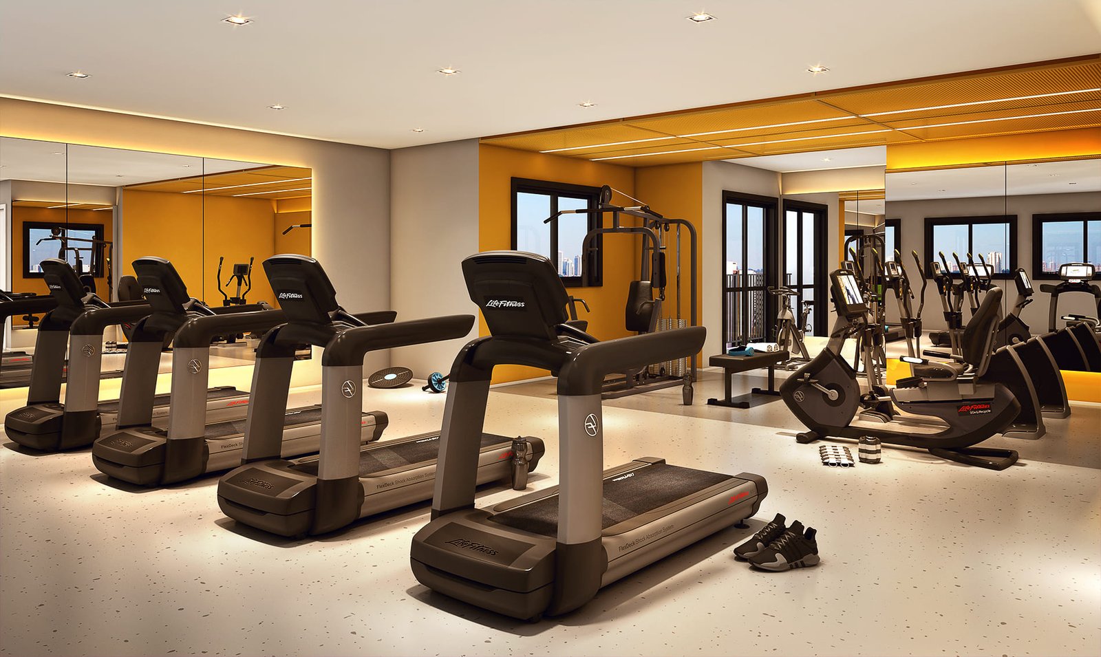 Perspectiva do espaço fitness com esteiras e equipamentos de musculação